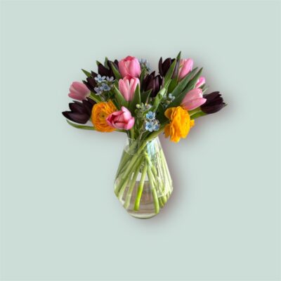 arrangement of tulips for easter in a glass vase