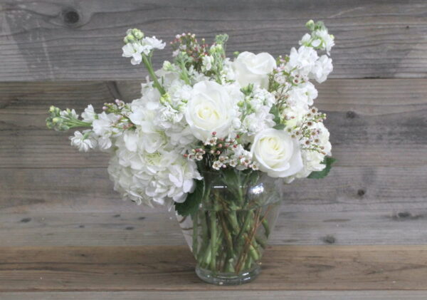 bouquet of white flowers in a glass vase