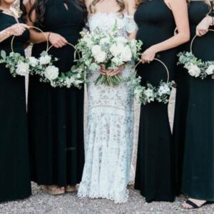 Bridal party holding white flowers.