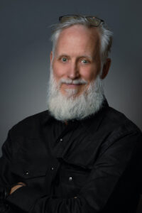 picture of a man with a beard wearing a black shirt